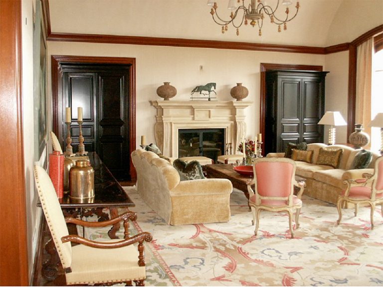 Living room with paneled doors, casings and crown moulding